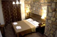 A bed or beds in a room at Iris Spa