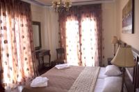 A bed or beds in a room at Iris Spa