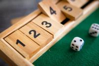 a close up of wooden dice on a pool table at Campanile Limoges Centre - Gare in Limoges