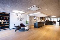 an office lobby with chairs and a counter at Campanile Limoges Centre - Gare in Limoges