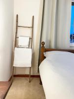 Postel nebo postele na pokoji v ubytování 212 Apartment, A 2-bedroom escape