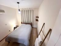 Postel nebo postele na pokoji v ubytování 212 Apartment, A 2-bedroom escape