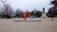 a heart sculpture in a park with a statue at Campanile Valence Sud in Valence