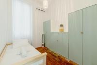 a white room with a bed and a glass shower at |Aaa|- Pure &amp; Natural Massilia City Center in Marseille