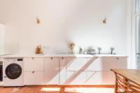 a white kitchen with a washer and dryer at |Aaa|- Pure &amp; Natural Massilia City Center in Marseille