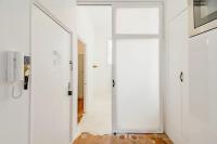 a hallway with a door in a white room at |Aaa|- Pure &amp; Natural Massilia City Center in Marseille