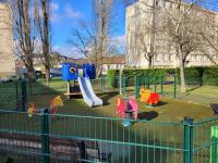 a playground with a slide in a park at La Compiègnoise - Spacieux - Lumineux - Cosy in Compiègne