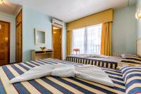 Postel nebo postele na pokoji v ubytování Hotel Mediterráneo