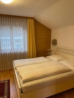 A bed or beds in a room at Landhaus Kreuz