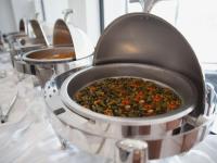 a row of pots filled with food on a table at Sherao Hotel Doha - Next to National Museum of Qatar & Metro - فندق شراعوة الدوحة - بجانب متحف قطر الوطني ومحطة المترو in Doha