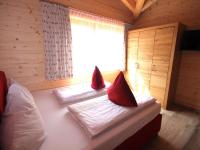 Łóżko lub łóżka w pokoju w obiekcie Kaprun Lodge - R