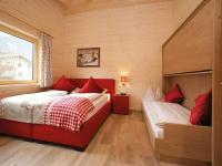 Łóżko lub łóżka w pokoju w obiekcie Kaprun Lodge - R