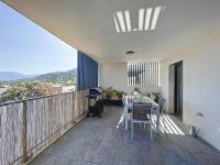 a balcony with a table and chairs on it at Appartement Calvi, 2 pièces, 4 personnes - FR-1-719-13 in Calvi
