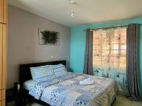 Trudy homes 1 bedroomにあるベッド