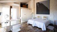 A bed or beds in a room at Casa Rural La Chocolateria