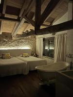 A bed or beds in a room at Casa Rural La Chocolateria
