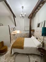 A bed or beds in a room at Casa Rural La Chocolateria