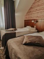 Posteľ alebo postele v izbe v ubytovaní Hotel Azyl