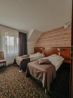 Posteľ alebo postele v izbe v ubytovaní Hotel Azyl