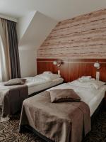 Posteľ alebo postele v izbe v ubytovaní Hotel Azyl