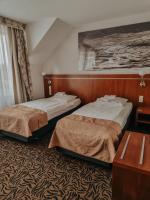 Posteľ alebo postele v izbe v ubytovaní Hotel Azyl