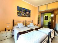 A bed or beds in a room at Attico Talenti