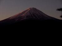 a snow covered mountain in the distance at Guesthouse Sakuya in Fujikawaguchiko