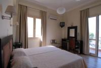 Postel nebo postele na pokoji v ubytování Hotel Karthea