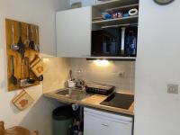 a small kitchen with a sink and a counter at Studio Crest-Voland, 1 pièce, 4 personnes - FR-1-733-151 in Crest-Voland