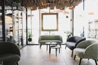 a lobby with couches and a table in a room at Hotel Gamshag in Saalbach-Hinterglemm