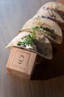 a wooden table with a sandwich on top of a box at Hotel Gamshag in Saalbach-Hinterglemm