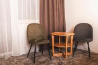 two chairs and a table in a room at Hotel Gamshag in Saalbach-Hinterglemm