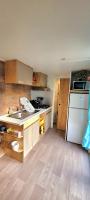 a small kitchen with a sink and a refrigerator at Camping Aux Portes De Cassis in La Bédoule