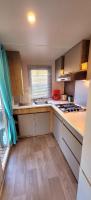 a small kitchen with a sink and a stove at Camping Aux Portes De Cassis in La Bédoule