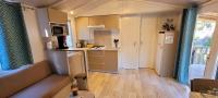 a small kitchen with a sink and a refrigerator at Camping Aux Portes De Cassis in La Bédoule