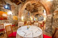 a dining room with a white table and chairs at Relais & Spa Castello di Casiglio in Erba