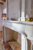 a white marble table with a lamp on top of it at Gîte Apolise in Saint-Rémy-la-Varenne