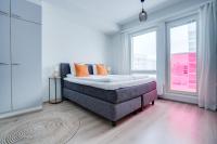 a bedroom with a bed and a large window at Lapin Loiste 1, Modern studio, Free Parking and Wifi in Rovaniemi