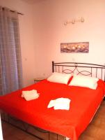 A bed or beds in a room at Villa Stella Family House