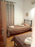 A bed or beds in a room at Villa Stella Family House