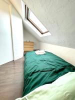A bed or beds in a room at Appartement Duplex 90m2 - 3 chambres - Mulhouse