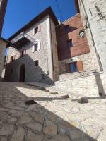 an external view of a stone building at Μikri Arktos Boutique Hotel in Dhimitsana