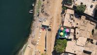 an overhead view of a beach next to the water at Nubian Popeye - Roof top - Nile View in Aswan
