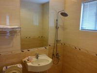 a bathroom with a sink and a shower at Foot Track Bed and Breakfast in Hualien City