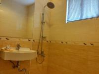 a bathroom with a sink and a shower at Foot Track Bed and Breakfast in Hualien City