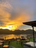 a view of the sunset from the deck of a restaurant at Phi Phi Mountain Beach Resort SHA Certified in Phi Phi Don