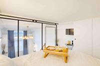 a bedroom with a tray of orange juice on a bed at WELC&#39;HOME IN HOULGATE - Vue et accès direct sur mer in Houlgate