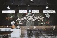 un muro con un cartello che recita "panificio locale Baja" di The Swarna Hotel Bayah Lebak a Muaramadur