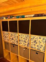 a wooden cabinet with floral patterns on it at Appart. spacieux et lumineux 4 pers. in Morez