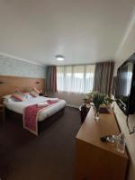 TV a/nebo společenská místnost v ubytování Hermitage Park Hotel
